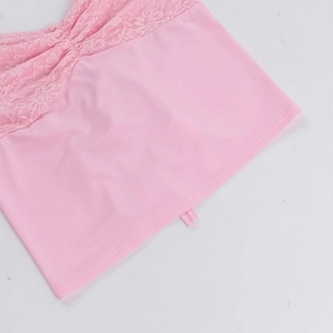 Detail of pink lace patchwork and smooth fabric texture on a halter neck top