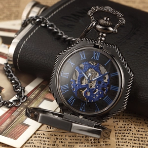 Detail of mechanical pocket watch with blue hollow dial and Roman numerals on vintage background