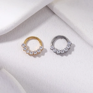 G23 titanium hinged clicker rings in gold and silver finish with set cubic zirconia gems