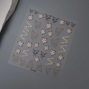 Detail of Co-569 nail stickers featuring gold leopard print and floral metallic patterns