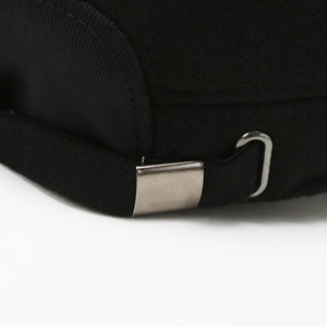 Black wool blend flat top cap with adjustable fabric strap and silver metal buckle detail