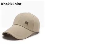 Detail of khaki baseball cap featuring twill fabric and side metal M-letter ornament