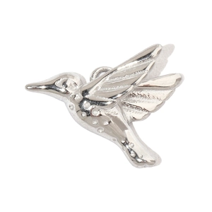 Detailed macro view of a silver hummingbird pendant with polished texture and metal details