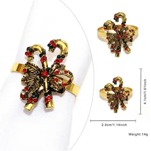 Detail view showing candy cane bow napkin ring dimensions of 4.1cm by 2.9cm