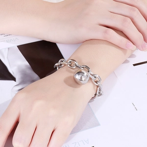 Fashionable stainless steel thick chain bracelet with a polished silver hollow ball pendant