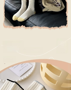Detail of ribbed knit cotton socks in cream white with yellow color-block toe design