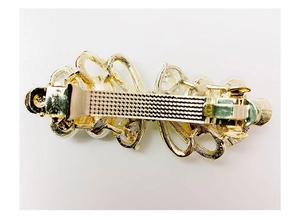 Macro shot of the spring hair clip back mechanism with pearls and crystals