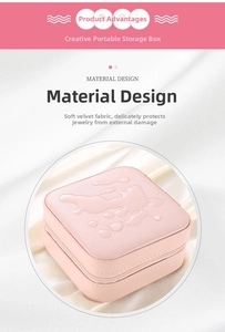 Detailed view of pink jewelry box with waterproof PU exterior and soft beaded velvet lining