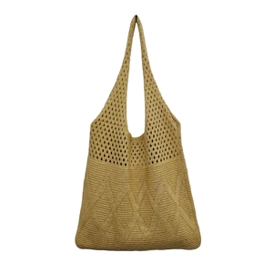 Detail of beige knit tote bag showing intricate hollow mesh and diamond woven patterns