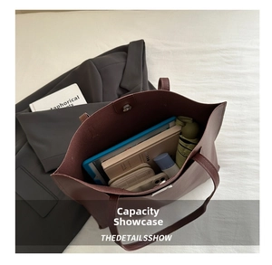 Top view of large burgundy tote bag interior showing spacious storage for tablet and essentials