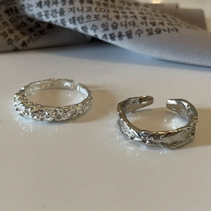 Detailed view of 925 silver open rings with unique molten lava texture and hammered finish