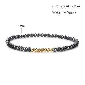 Detail view of 3mm black hematite beads and gold accents on an elastic bracelet