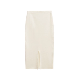 Close-up of cream knit midi skirt featuring an elastic waist and front slit detail