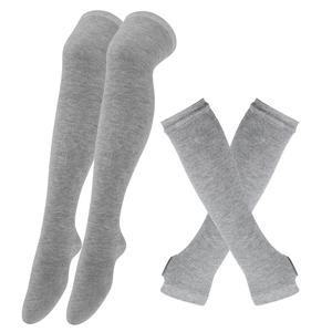 Detailed view of grey knitted over-the-knee socks and matching thumbhole arm warmers set