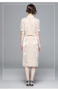 Detail of floral embroidery on a modern Chinese style two-piece skirt set and waist tassel