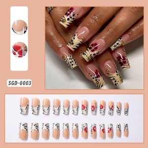 Macro detail of nude nails with leopard print, red flowers, and gold studs, SGD-0003