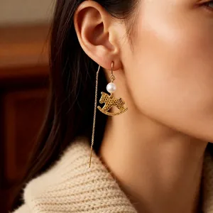 Elegant gold rocking horse earrings with pearls on long chain ear threads for women