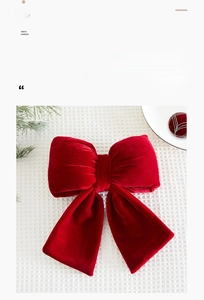 Detail of a large red velvet bow ornament with high-quality fabric texture for festivals