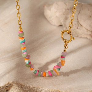 Close-up of bohemian turquoise stone necklace with gold stainless steel chain