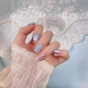 Handmade mermaid shell press-on nails with blue purple gradient and gold star accents