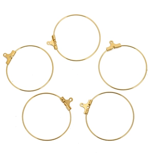 Close-up of golden stainless steel hoop earring findings with lever back clasps for DIY jewelry