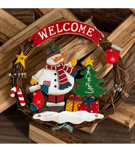 Close-up of vintage Christmas rattan wreath with snowman and wooden WELCOME sign