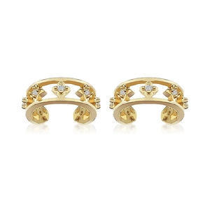 Macro detail of 24K gold plated floral ear cuffs with zircon heart and hollow design