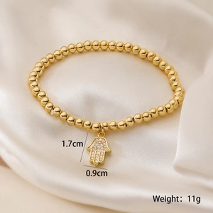 Detail of 18K gold-plated Hamsa hand charm bracelet with size info 1.7x0.9cm 11g