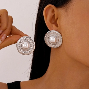Vintage silver-tone hammered metal round stud earrings with center white pearl inlay