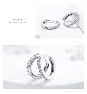 Macro shot of S925 sterling silver hoop earrings with clear round cubic zirconia stones