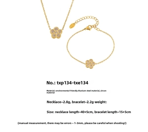 Macro view of gold zircon flower necklace and bracelet set with size specifications