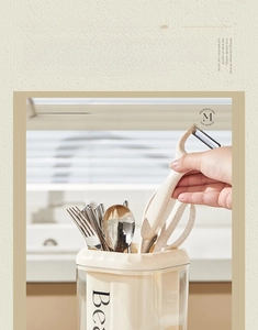 Macro shot of cream kitchen organizer showing drainage base and high transparency material