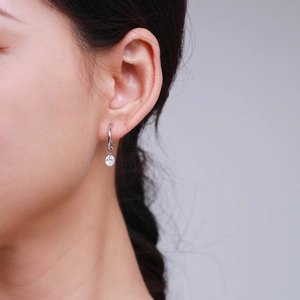 Elegant S925 sterling silver hoop earrings with sparkling zircon pendant on model