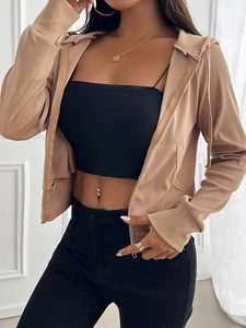 Detail of beige ribbed knit zip-up hoodie showing texture and front zipper closure
