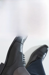 Close-up of breathable mesh texture on dark grey cotton dress socks with 10A antibacterial label