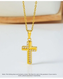Macro shot of gold cross pendant with cubic zirconia, excludes necklace chain