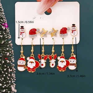 Detailed view of Christmas earring set with Santa and Snowman charms and size labels