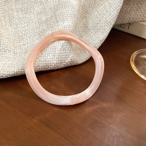 Macro detail of the pink marble resin texture on this vintage irregular bangle