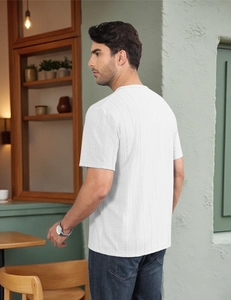 Close-up of white waffle knit texture and fit on a men's casual short sleeve t-shirt