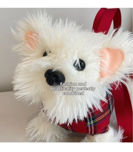 Detail of white plush Westie puppy bag featuring red plaid shirt and woven straps