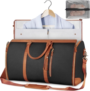 Macro view of black canvas travel bag interior with suit hanger and brown leather trim