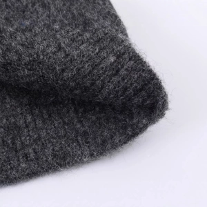 Close-up of contrast color knit cardigan with premium brushed texture and ribbing detail