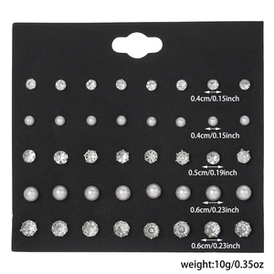 20 pairs of minimalist faux pearl and crystal stud earrings set on black display card