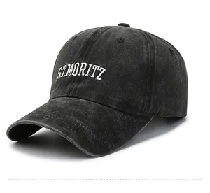 Detail view of washed cotton baseball cap with white ST MORITZ letter embroidery