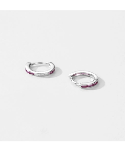Detail of silver S925 earrings featuring vibrant magenta baguette-cut zircon stones