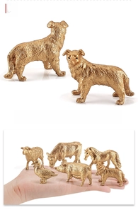 Miniature golden farm animal figurines set showing dog sheep and cow for micro landscape