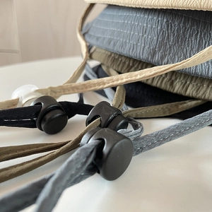 Detail of adjustable windproof rope and water ripple fabric on summer sun hats
