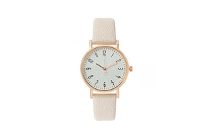 Detail of rose gold minimalist watch featuring a white marble dial and beige leather strap