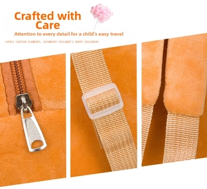 Detail of plush orange backpack with adjustable straps and smooth silver zippers