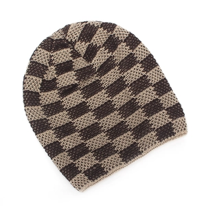 Close-up of winter knit beanie showing brown checkered pattern and warm ribbed texture